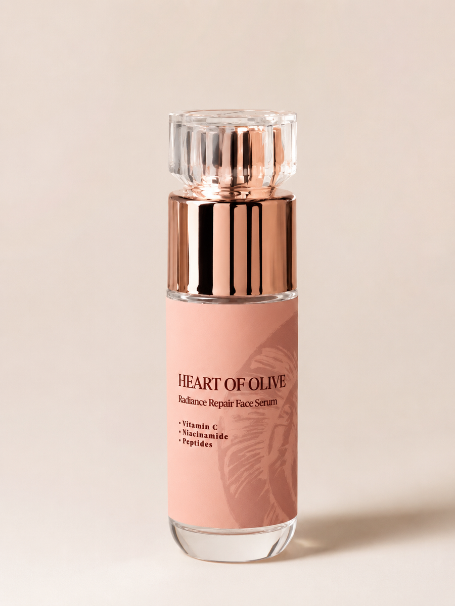 Heart of Olive Radiance Repair Face Serum with Vitamin C, Niacinamide, and Peptides in a botanical snail and bee extract formula.