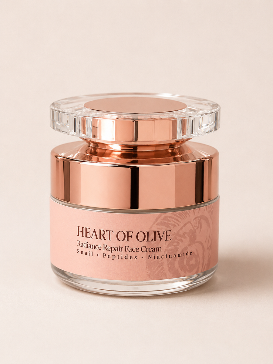 Heart of Olive Radiance Repair 24 Face Cream with snail extract, peptides, and niacinamide in an olive-colored jar.